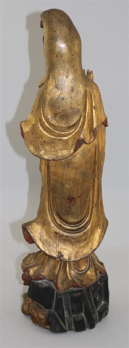 A late 19th century Chinese carved and giltwood figure of Guanyin, 20in.